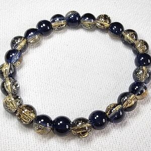 Elegant Gold and Black Bracelet Set with Ornate Beads